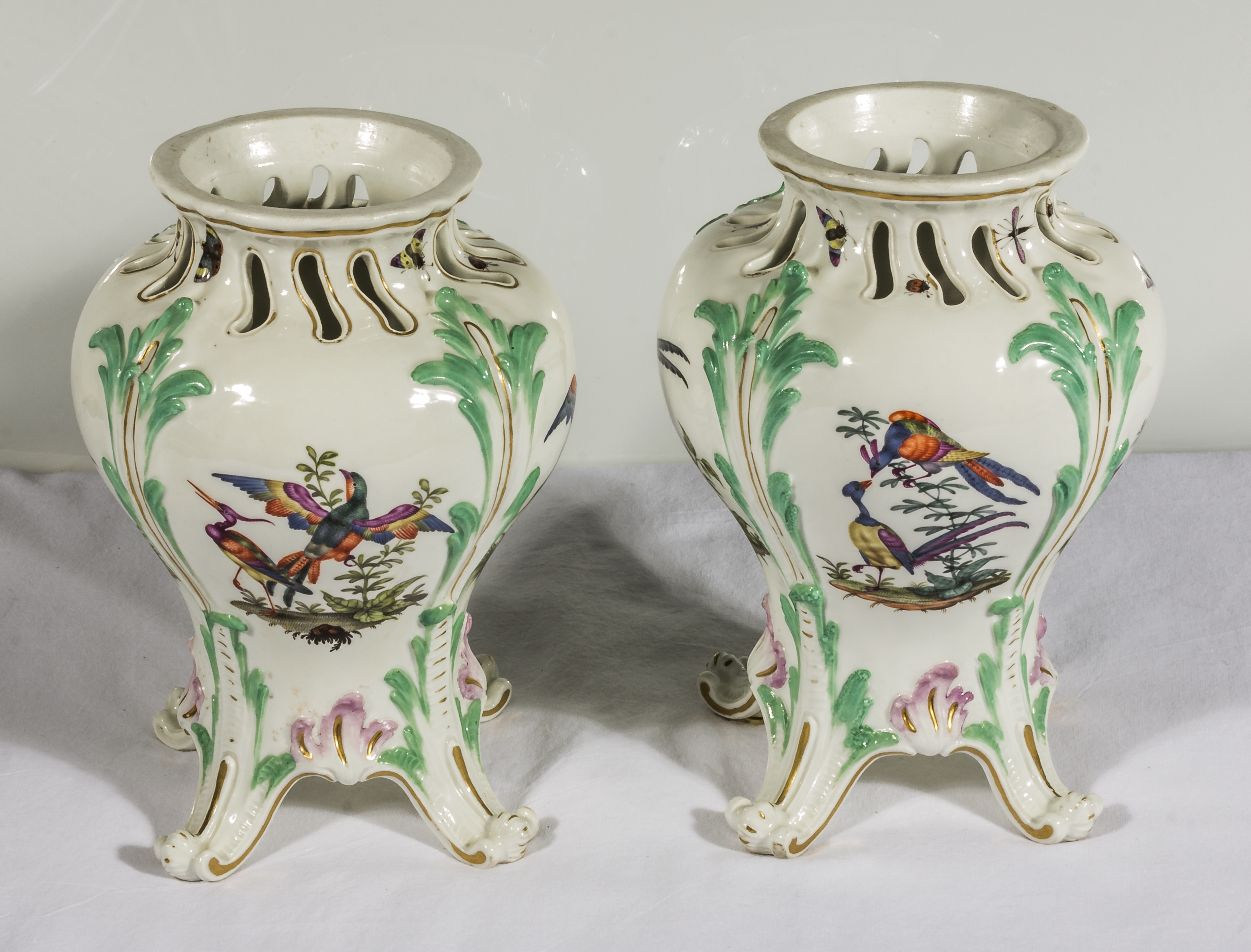 A pair of Continental vases decorated with birds