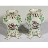 A pair of Continental vases decorated with birds