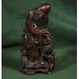 A Chinese carved bamboo figure of a sage