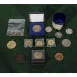 A collection of American coins including silver dollar and half dollars