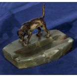 An onyx ashtray with cold painted bronze dog