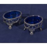 A pair of Georgian silver salts with blue glass liners