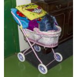 A toy pram and soft toys