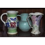 A Royal Doulton jug together with an Arthur woods Jug and one other