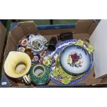 A box of pottery plates, bowls and vases