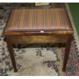 A piano stool with lift up lid