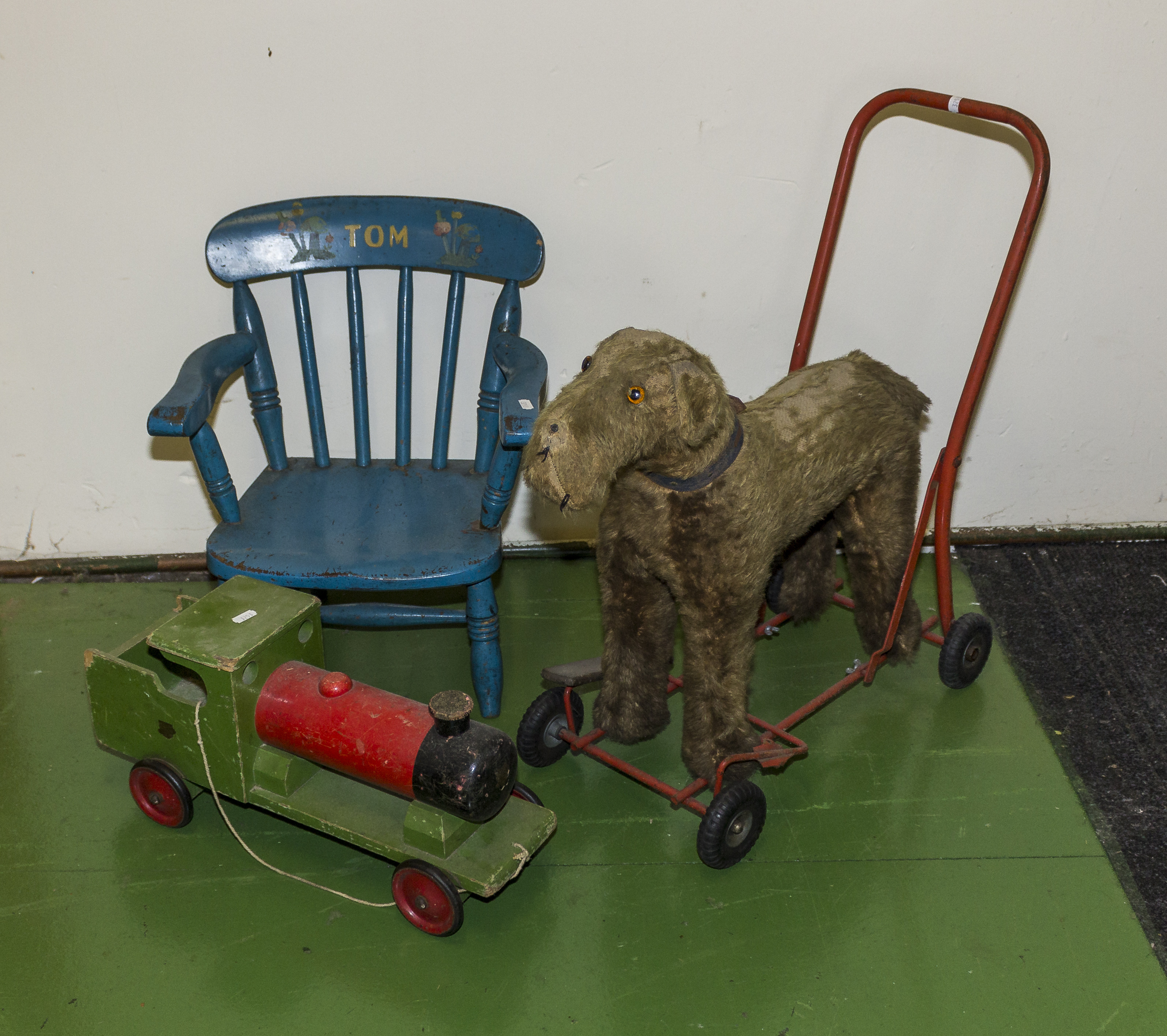 A vintage push along dog, train and a child's chair