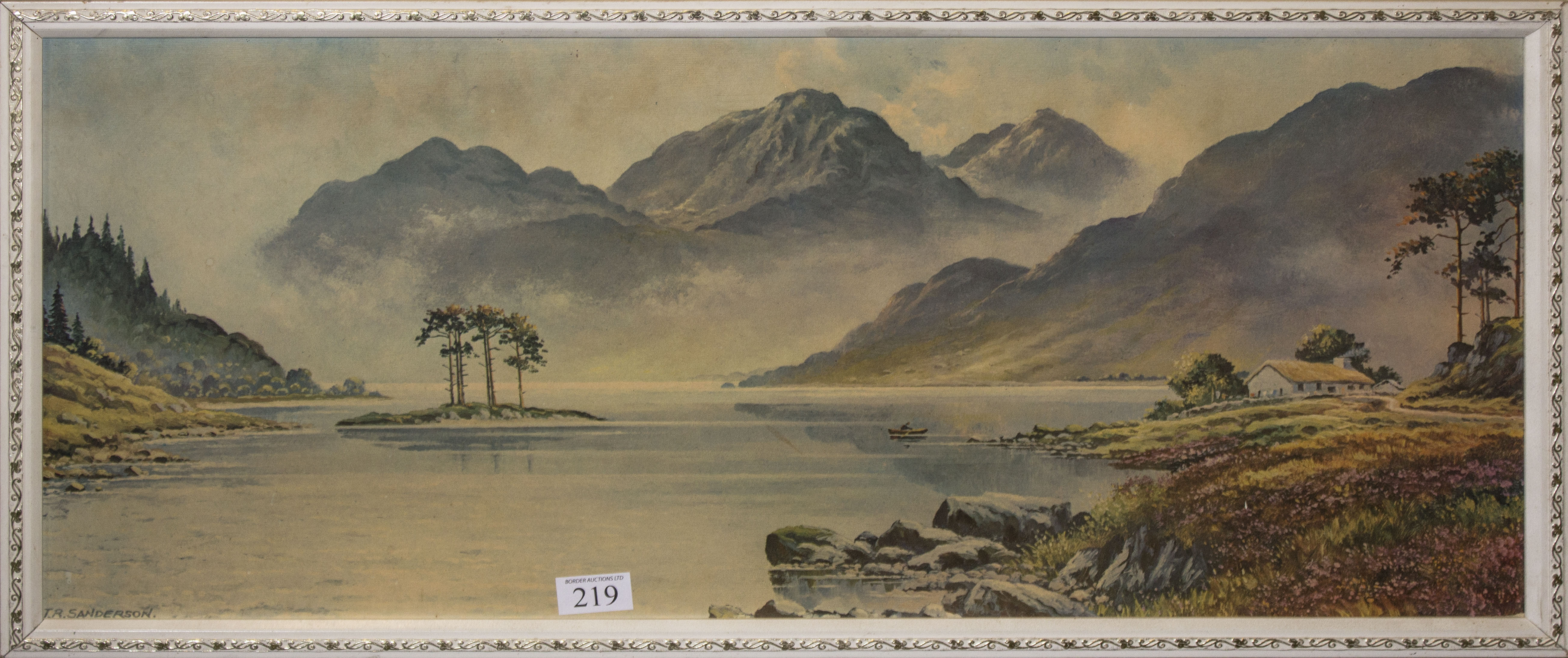 A framed print of a lake scene