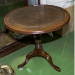 A small circular wine table