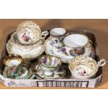 A collection of china cabinet cups and saucers