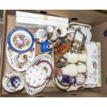 A box containing china vases, plates and other items