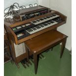 A Hammond organ and stool