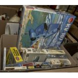 A box containing model kits including Airfix and Revell
