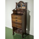 An Edwardian mahogany music cabinet.