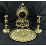 A pair of brass candlesticks, watch stand and a tray