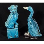 A blue pottery temple dog and a duck