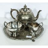 A silver plated tray, teapot and related sugar and milk