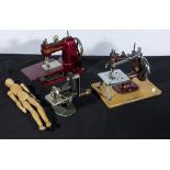 Two miniature sewing machines, a crimper and a wooden doll