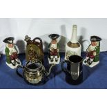 Three character jugs, teapot, water jug and a pottery flask