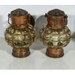 A pair of copper and glass ships lamps