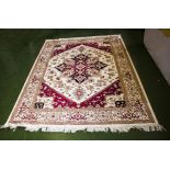 A beige ground Heriz carpet 2.30m x 1.60m