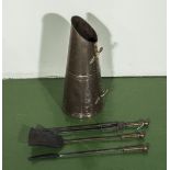 A copper coal scuttle and three fire irons