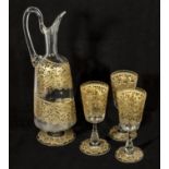 A Venetian glass decanter and three glasses