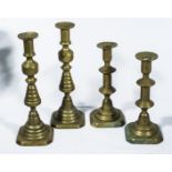 Two pairs of brass candlesticks