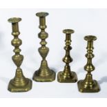 Two pairs of brass candlesticks