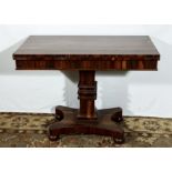 An early Victorian rosewood fold over tea table