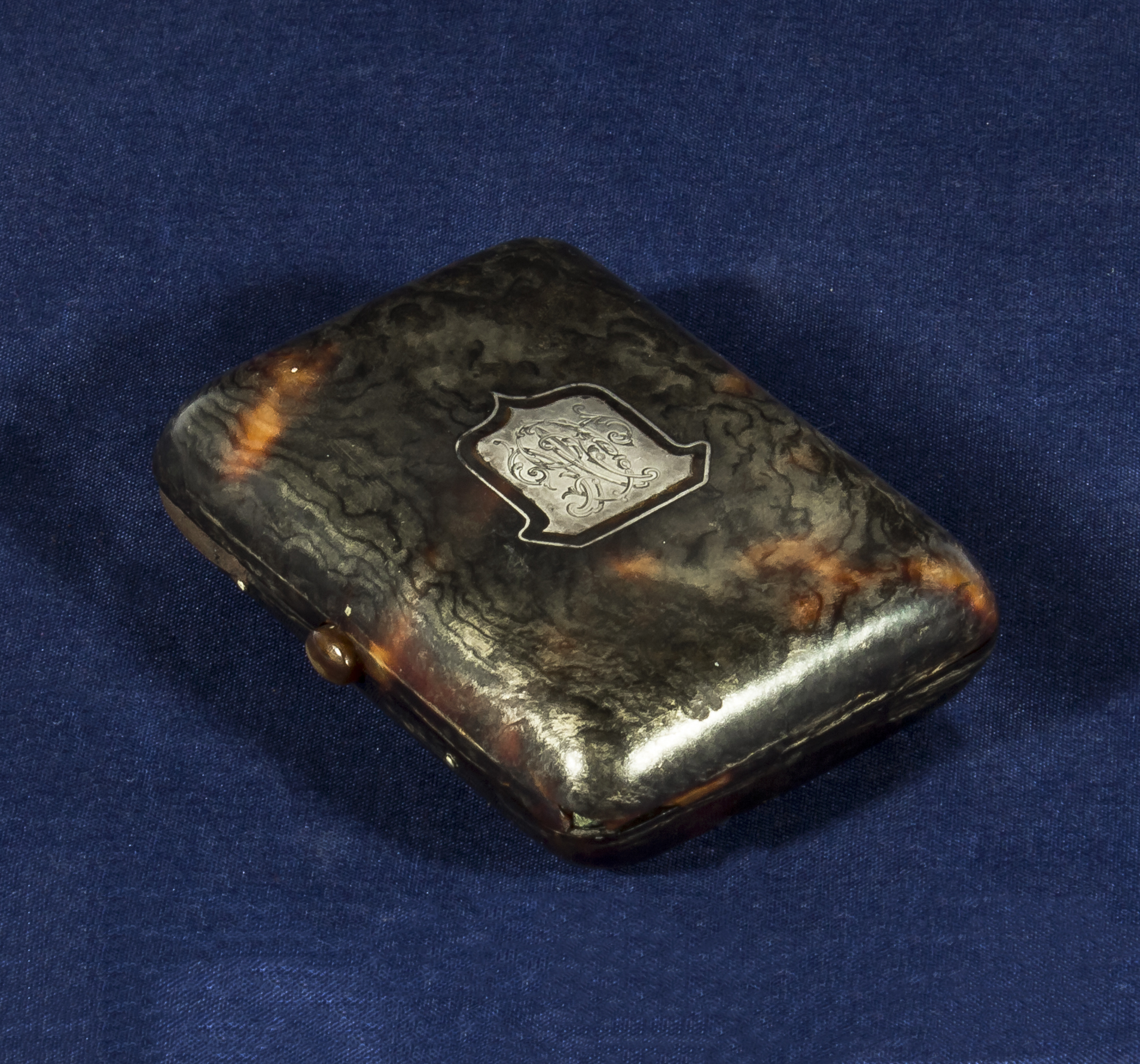 A tortoiseshell and silver purse