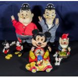 Laurel and Hardy toys together with Disney character figures