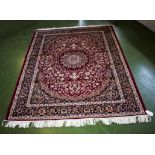 A red ground Keshan rug 1.90m x 1.40m