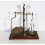 A large brass balance scales and weights