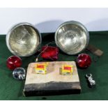 Vintage car lamps and a Leyland Motors manual