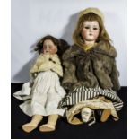 Two bisque head dolls