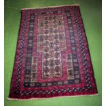 A hand woven wool Tribal Balochi rug 82cm x 131cm