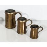 A set of three bronze measures, half pint, pint and quart