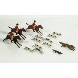 A near complete set of Britains lead fox hunting figures, three huntsmen on horseback two foxes