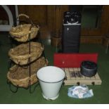 A camping gas stove, enamel bucket, veg rack and a travel cot