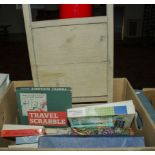 A box containing vintage games and a washboard