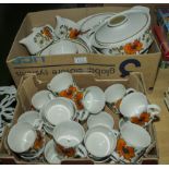 A quantity of Meakin poppy table ware