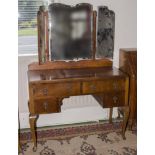 A 1950's walnut dressing table