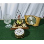 A terrarium, goblet, clock and an enamel lidded box