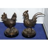 A modern bronze cockerel and a hen