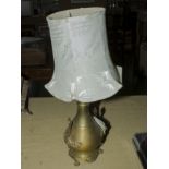 An Oriental style brass table lamp and shade