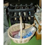 A wine rack together with a basket and contents