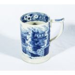 An early 19th century blue and white transfer printed mug, depicting a Brighton Pavilion type