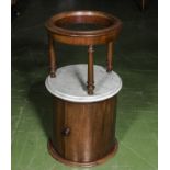 A Victorian pot cupboard with marble top and basin holder above