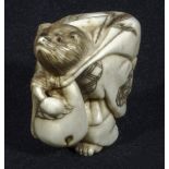 A Japanese netsuke, rat carrying a sack, signed